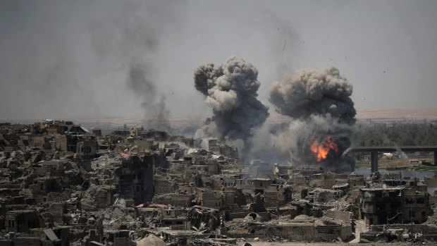 Air strikes target Islamic State positions on the edge of the Old City in Mosul, Iraq. 