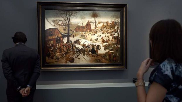 Visitors view <i>The Census at Bethlehem</i>, a newly discovered work by Pieter Brueghel the Younger, during a private viewing of the Frieze Masters 2013 art fair in London.