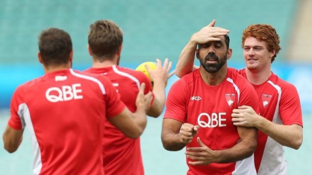 Doing it with his eyes closed: Adam Goodes gets his degree of difficulty raised by Gary Rohan.