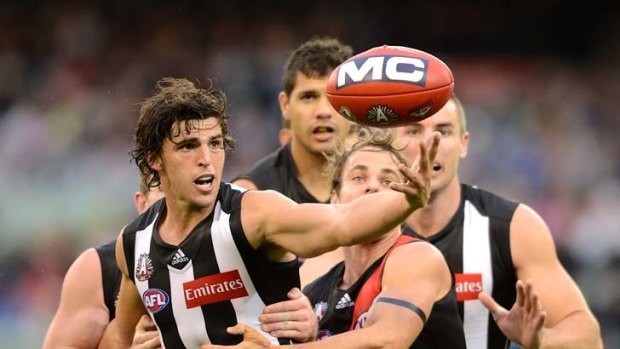 On a string: Collingwood's Scott Pendlebury wins the ball.
