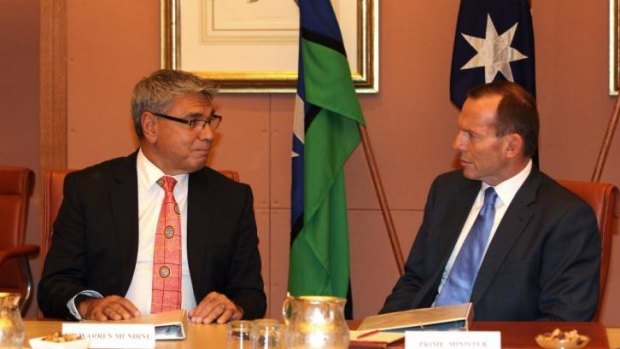Warren Mundine, pictured with Prime Minister Tony Abbott, says the government needs to drop proposed changes to the Racial Discrimination Act.