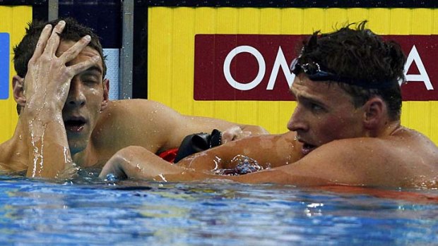 Close match: Michael Phelps (left) comes second behind US teammate Ryan Lochte in the men's 200 freestyle final yesterday.