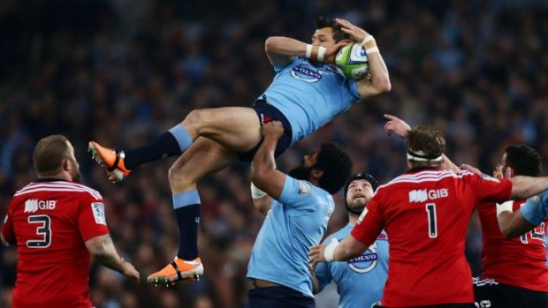 Flying high: Adam Ashley-Cooper grabs a kick for the Waratahs against the Crusaders at ANZ Stadium on Saturday night.