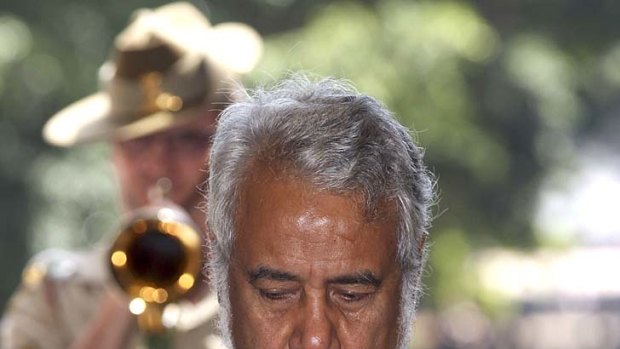 East Timor's Prime Minister Xanana Gusmao bows his head as the Last Post is played during a visit to the ANZAC Memorial in  Sydney yesterday.