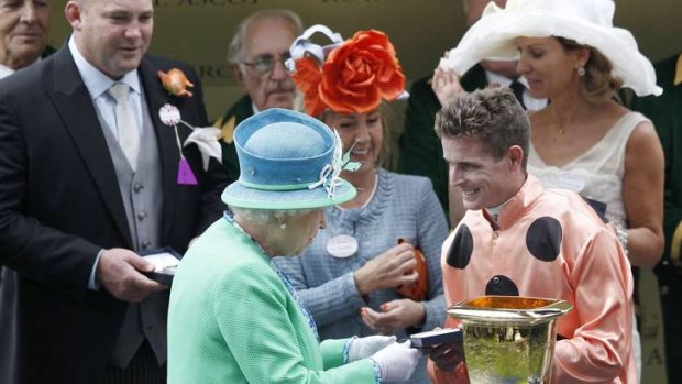 Nolen receiving his winners' memento from the Queen after winning the Diamond Jubilee Stakes at Royal Ascot in June.
