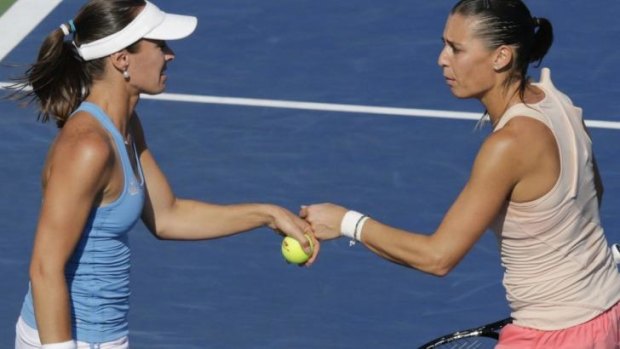 Former world No.1 Martina Hingis (L) with doubles partner Flavia Pennetta.