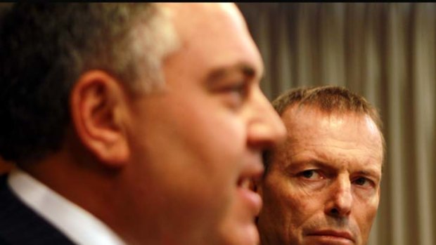 Anger ... Sources have confirmed a fiery conversation between Joe Hockey, left, and Tony Abbott.
