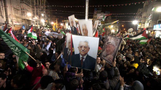 A country born: Palestinians celebrate the historic vote to become a non-member observer state at the UN.