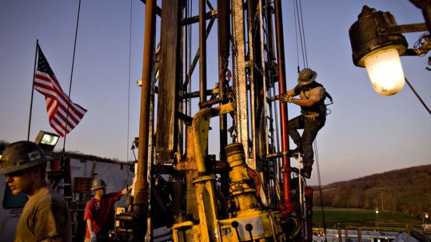 Using the latest fracking technology, US workers extract liquefied natural gas from a drill site in Pennsylvania.