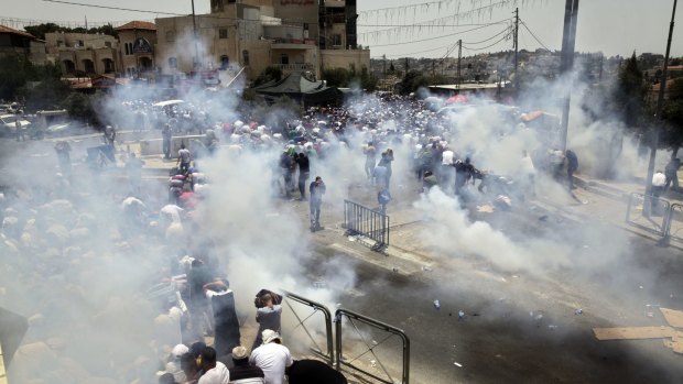 Tear gas is used on Palestinian protesters in Jerusalem on Friday.