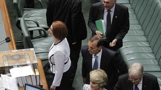 Prime Minister Julia Gillard and Opposition Leader Tony Abbott during question time at Parliament House.