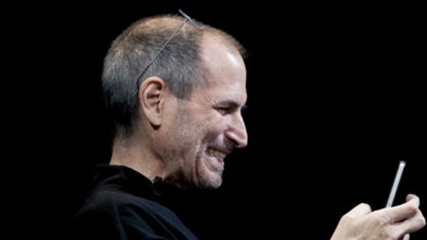 Apple chief executive officer Steve Jobs with an iPhone 4.