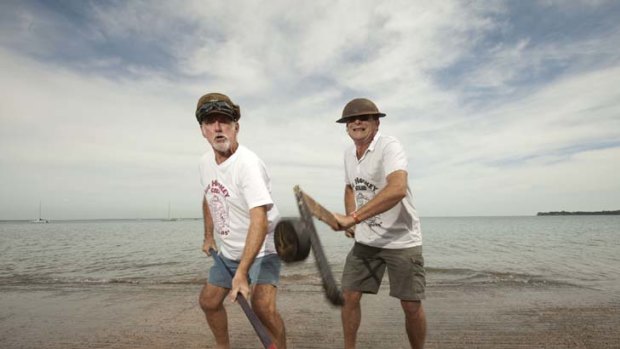 Happy Vegemites ... Baz Ledwidge, left, and Stephen Hall show how ice hockey is played in Darwin.