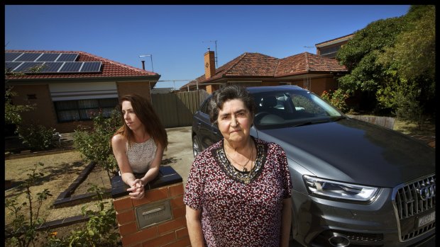 Rosa Bogar (left) pictured with her son Attila Bogar's friend Carly Heard and Attila's car which was found abandoned near Wollongong.  