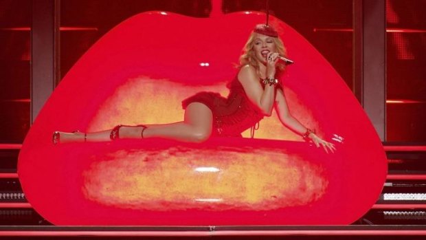 Kylie Minogue began the night in a red glittering corset.