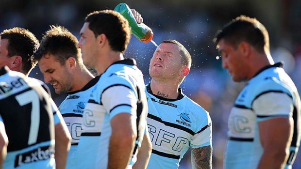 That sinking feeling: Todd Carney cools off during the Sharks fourth loss in a row.