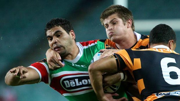Greg Inglis finds it tough to get past the Tigers defence.