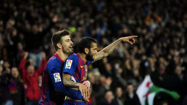 Daniel Alves celebrates his stunning goal for Barcelona.