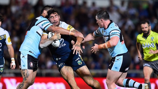 Onslaught: Cowboys prop James Tamou is tackled by Paul Gallen and Andrew Fifita.