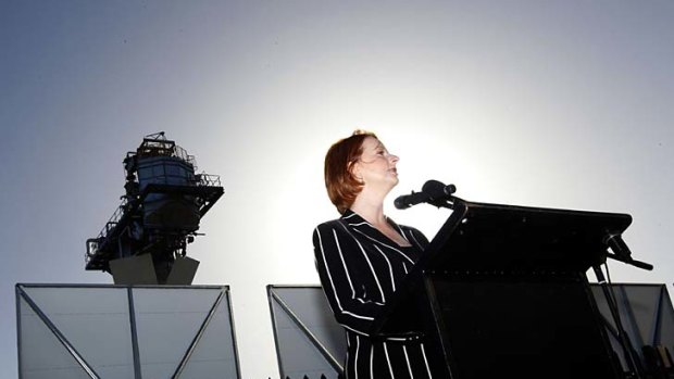 Prime Minister Julia Gillard opens a thermal tower in Newcastle yesterday. Questions about her future dogged her wherever she went, but Ms Gillard said she felt 'very secure' in her job.