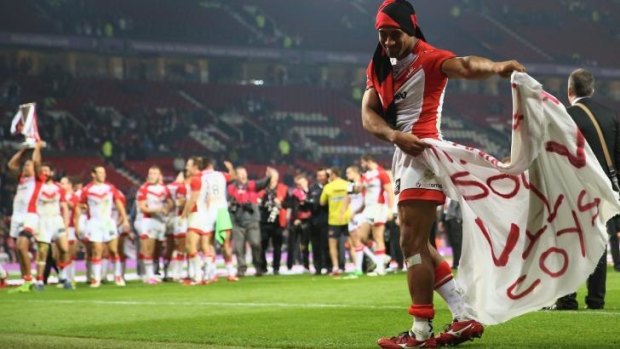 Sia Soliola of St Helens celebrates in front of Saints fans.