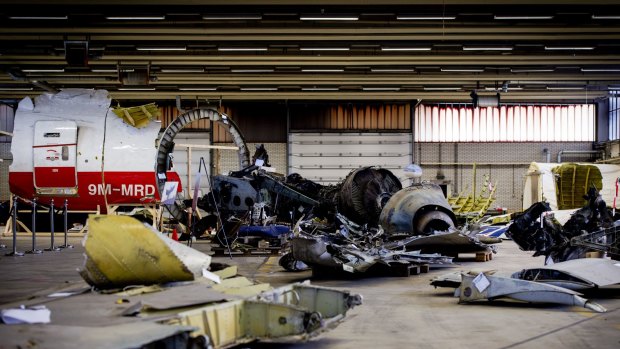 Wreckage from Malaysia Airlines Flight MH17, which was shot down over Ukraine in July 2014, is laid out in a hangar on Gilze-Rijen airbase in the Netherlands. 