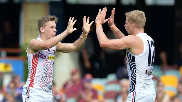 Jack Lonie celebrates with Nick Riewoldt.