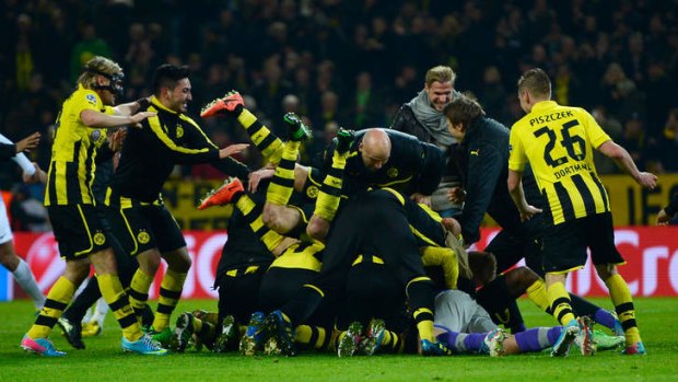 Late drama: Borussia Dortmund players celebrates victory.