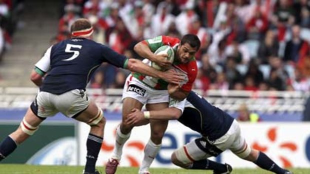 Impact player ... Karmichael Hunt hits it up for Biarritz in the Heineken Cup.
