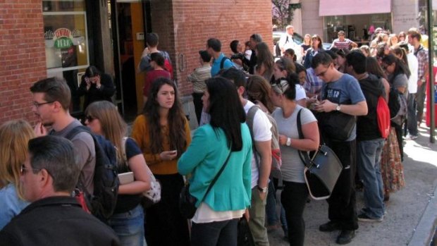 Tourists line up outside a temporary "pop up" reproduction of the "Central Perk" coffee shop.