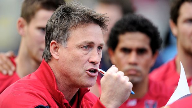 Demon desire: Caretaker coach Todd Viney urges the Melbourne players on at the MCG yesterday.