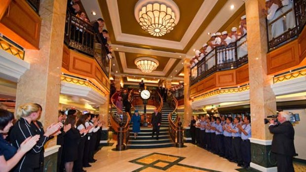 Britain's Queen Elizabeth (centre L), tours Cunard's new cruise ship the Queen Elizabeth.