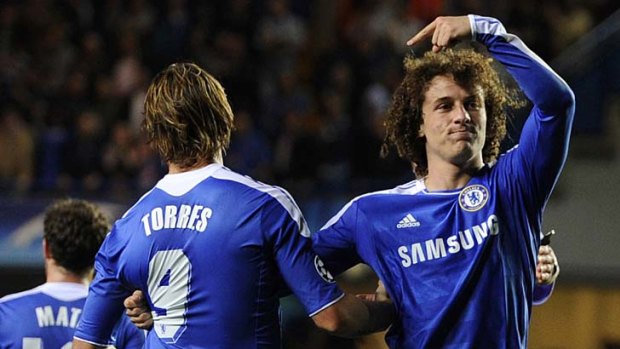Clique: David Luiz (right) pointedly celebrated his goal in Chelsea's Champions League win over Bayer Leverkusen with beleaguered striker Fernando Torres. There have been hints of division in the squad.