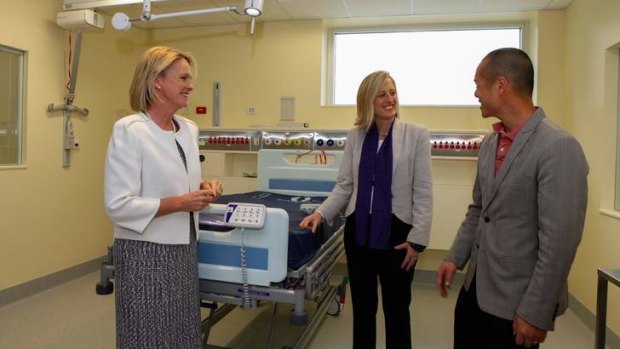 (right) Acting clinical director of ICU Dr Sean Chan talks to Fiona Nash and Katy Gallagher about the new facilities.