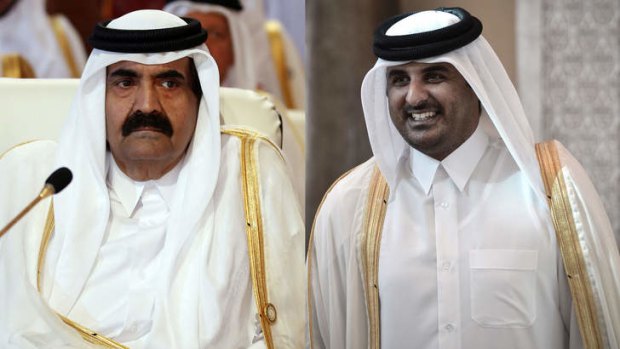 Qatar's Emir Hamad bin Khalifa al-Thani attending the opening of the Arab League summit in the Qatari capital Doha, and his son, Qatari Crown Prince Sheikh Tamim bin Hamad al-Thani. AFP PHOTO/KARIM SAHIB /MOHAMMED AL-SHAIKH