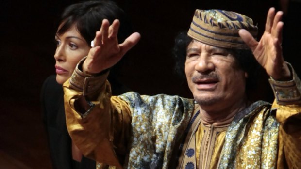 The Italian Minister for Equal Opportunities, Mara Cafagna, with Libyan leader Muammar Gaddafi at a gathering of prominent Italian women.