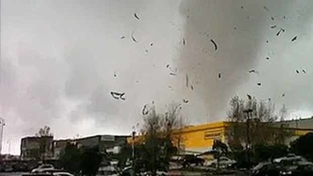 The tornado hits the shopping centre.
