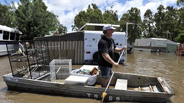 Pets are salvaged from flood waters.