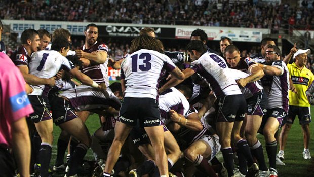 Mayhem ... the Brookvale crowd bayed for blood at Friday night's clash between Manly and Melbourne.