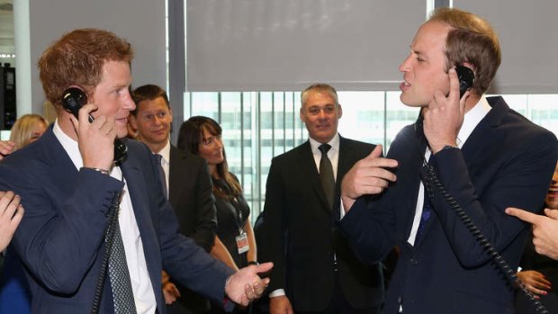 Britain's Prince Harry (L) and his brother Prince William  take part in a trade during the BGC Charity Day 2013 in London, on September 11, 2013. The event is in memory of those who died in the World Trade Centre attacks and supp0orts a number of UK charities.