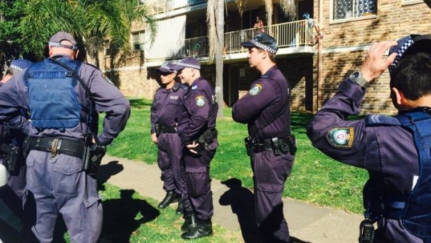 Police raid a Wentworthville unit. 