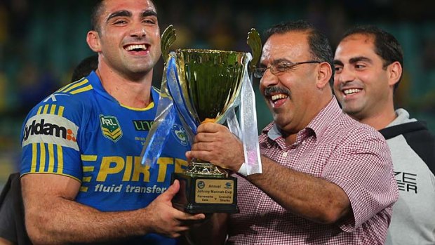 Tribute: Tim Mannah with his father Fred.