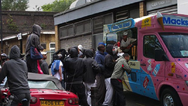 Sugar rush ... Looters queue up for ice cream.