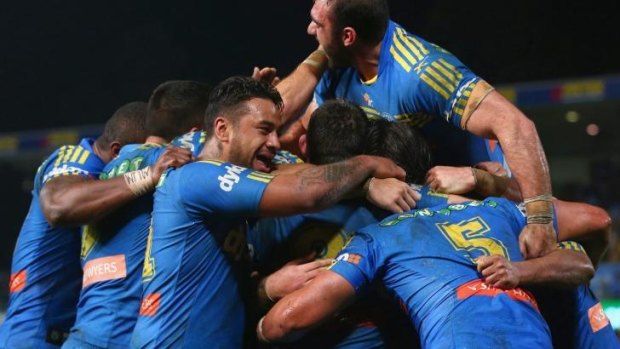 Parra power: Eels players celebrate a try against Manly on Friday night.
