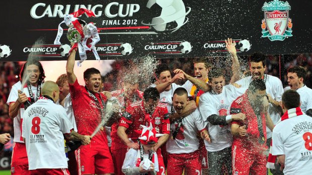 Liverpool players celebrate their League Cup victory.