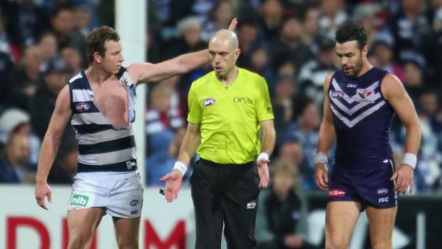 Ross Lyon doesn't want umpires guessing at free kicks for players like Steve Johnson (left).