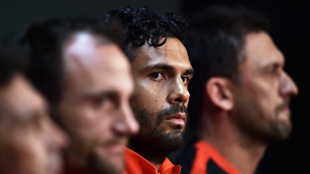 Resolve: Wanderers captain Nikolai Topor-Stanley and coach Tony Popovic (third and far right) can end a long drought for Western Sydney's football fans.