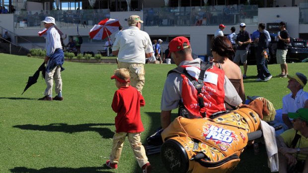 John Daly walks of in a rage after hitting the water again.