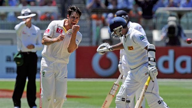 Mitchell Johnson celebrates the wicket of Prasanna Jayawardene, but the LBW verdict was overturned.