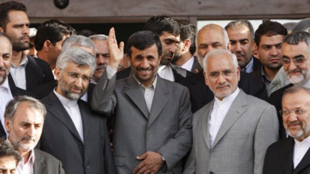Mahmoud Ahmadinejad, centre, with nuclear officials this month.